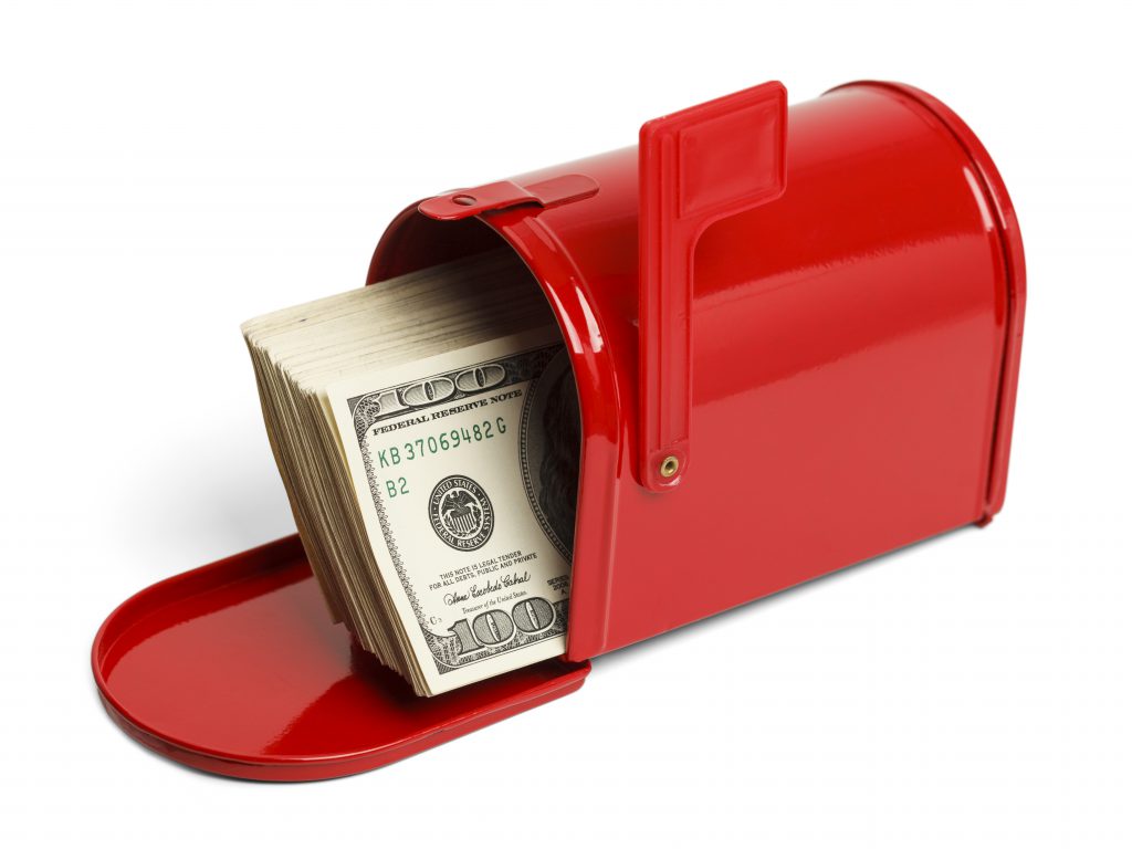 red mailbox with money in it. tax refund