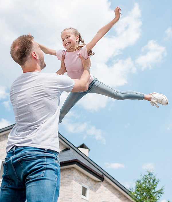 father daughter smiling and playing